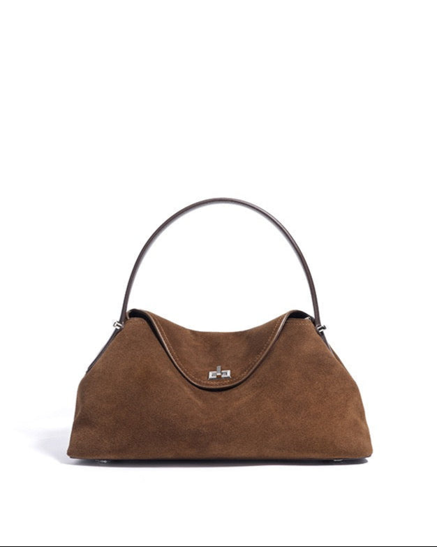 Brown handbag with a visible brand logo on a white background